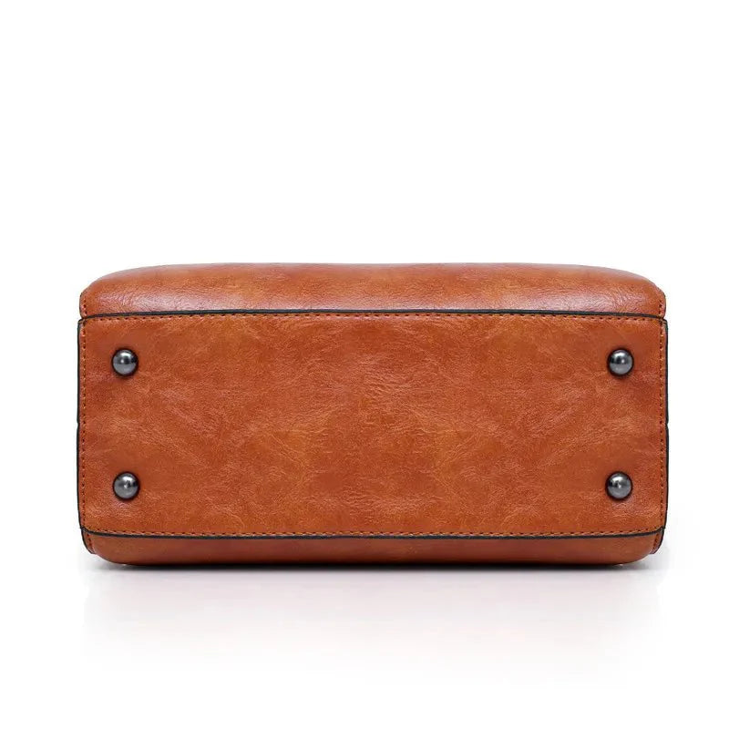 Kit Premium em Couro Genuino - Bolsa + Carteira + Carteira de Mão + Necessaire de Brinde